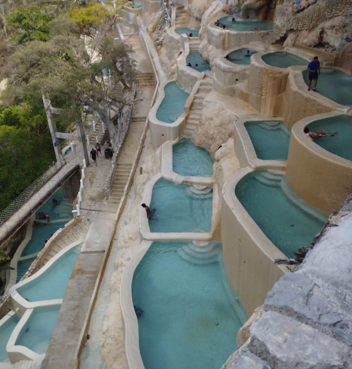 Looking down the pool terraces at Grutas Tolantongo, with the stone steps and path beside them